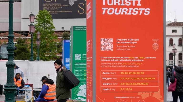 Tourist information boards are seen outside the main train station...