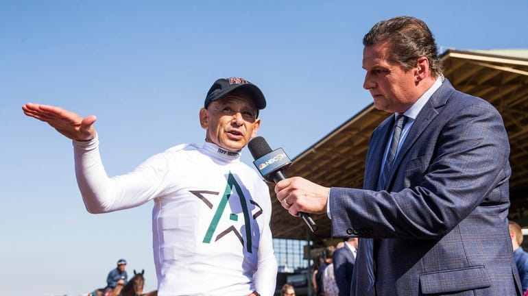 Justify's jockey Mike Smith talks to Ed Olczyk after winning...