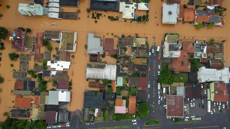 Streets are flooded after heavy rain in Sao Sebastiao do...