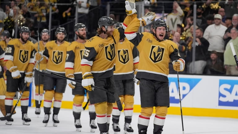 Vegas Golden Knights celebrate after defeating the Dallas Stars in...