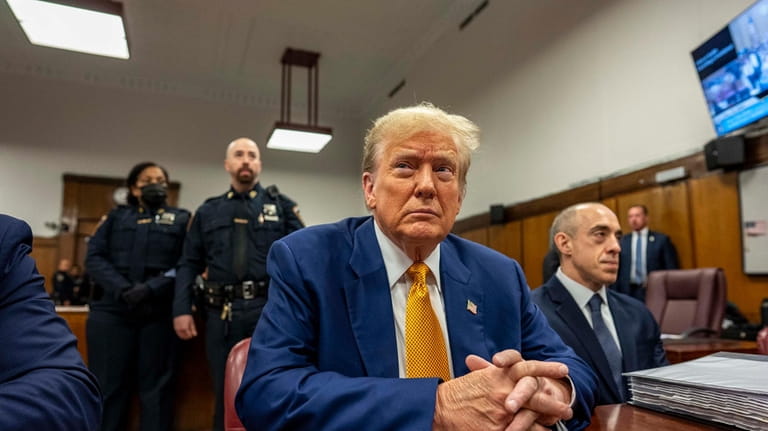 Former President Donald Trump sits inside Manhattan Criminal Court, Thursday,...