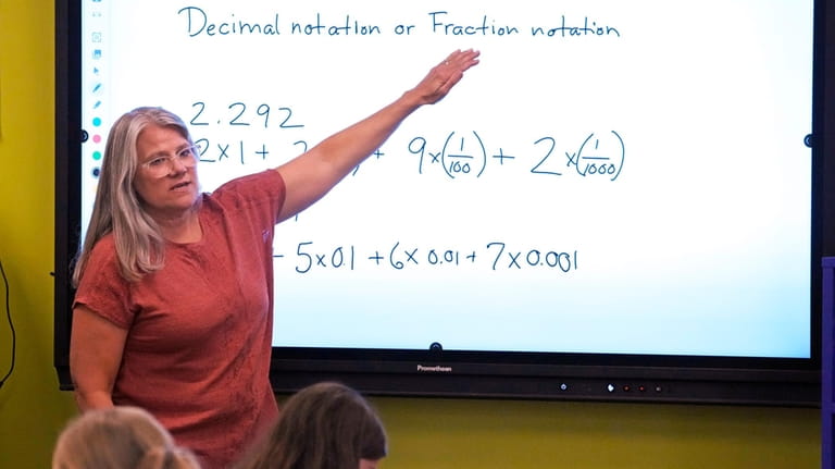 Math teacher Margie Howells teaches a fifth grade class at...
