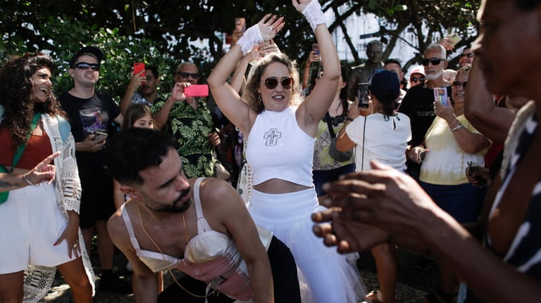 Madonna fans dance outside Copacabana Palace hotel where Madonna is...