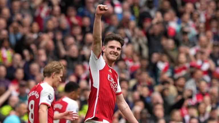 Arsenal's Declan Rice celebrates after scoring his side's third goal...