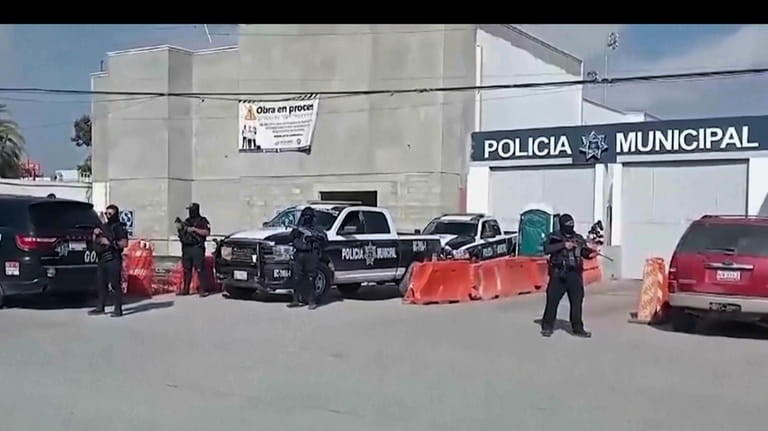 In this image made from video, Mexico's police officers stand...