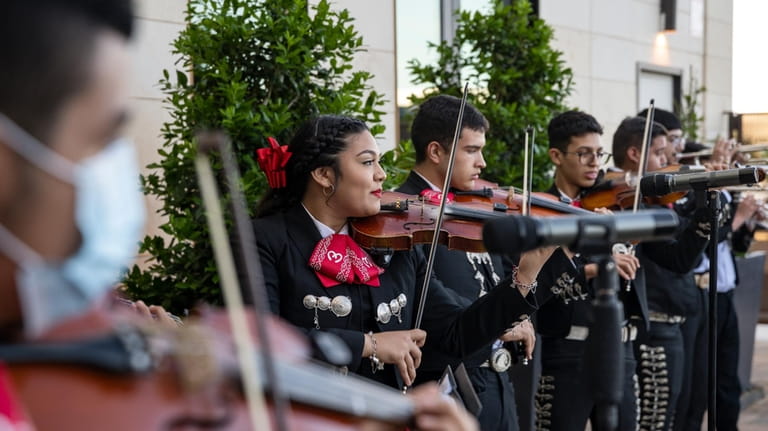 Members of the Odessa High School mariachi band perform at...