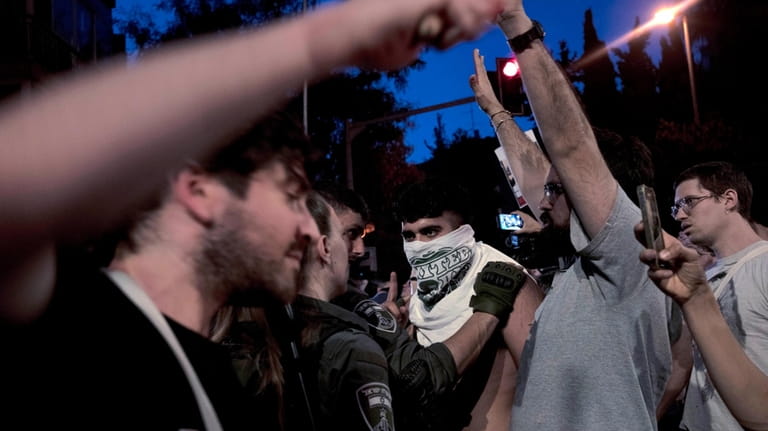 Police restrain a supporter of Israeli-American hostage Hersh Goldberg-Polin, who...