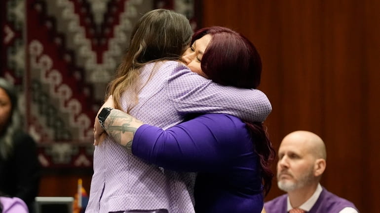 Arizona Rep. Stephanie Stahl Hamilton, D-Tucson, left, gets a hug...